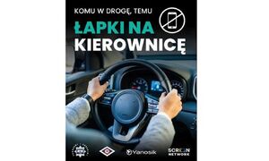 Grafika promująca akcję "Łapki na kierownicę". Grafika przedstawia kierownice na której położone są ręce.