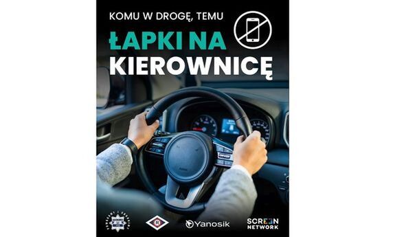 Grafika promująca akcję "Łapki na kierownicę". Grafika przedstawia kierownice na której położone są ręce.